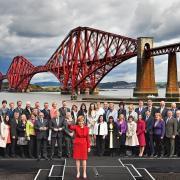 First Minister and leader of the SNP Nicola Sturgeon is joined by the newly elected members of parliament as they gather in front of the Forth Rail Bridge on May 9, 2015 in South Queensferry, Getty Images