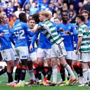 Rangers and Celtic players square up to each other after the final whistle at Ibrox yesterday