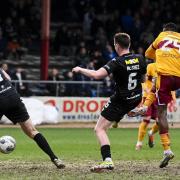 Moses Ebiye caps off a remarkable Motherwell comeback on the rutted Dens Park pitch.