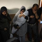 Members of the Abu Draz family mourn their relatives killed in the Israeli bombardment of the Gaza Strip, at their house in Rafah, southern Gaza