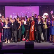 The winners of the 2023 The Herald & GenAnalytics Diversity Awards  celebrate on stage