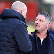 Dundee manager Tony Docherty, right, speaks to his Rangers counterpart Philippe Clement at Dens Park