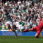 Celtic winger James Forrest curls his team into the lead against Aberdeen at Hampden.
