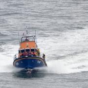 A group of people thought to be migrants are brought in to Dover, Kent, onboard the RNLI Dover Lifeboat following a small boat incident in the Channel