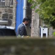 Humza Yousaf entering Bute House by a side door