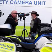 Bikers Chas McLeod, left, and Jock McGaughey from South Queensferry check out the new speed camera to be deployed by Police Scotland motorcycle division in 2016 (stock pic)