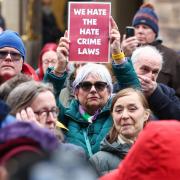 Protesters demonstrated outside the Scottish Parliament as the Hate Crime Law came into force