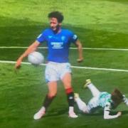 The ball strikes Ben Davies' arm during Celtic vs Rangers