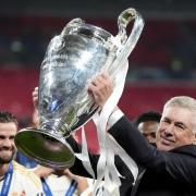 Real Madrid manager Carlo Ancelotti celebrates with the trophy after winning the Champions League final at Wembley (Nick Potts/PA)