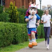 Eilish McColgan with Commonwealth Games mascot Finnie: But is the passion there?