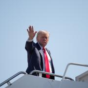 Donald Trump boards Air Force One as he departs for Scotland