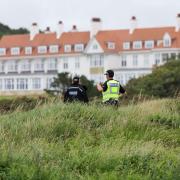 Police outside the perimeter of Turnberry golf course in South Ayrshire, ahead of the arrival of US President Donald Trump to begin his five-day private trip to the country.