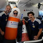 Andrew Dobbie, a member of the Delta cabin crew, the cone and Danny Campbell, a traffic cone which has been flown from Scotland to Boston as a symbol of friendship