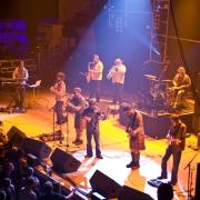 Graeme Stafford, Peter Tickell, Peter Morrison, Paul Towndrow, Adam Sutherland, Innes Hutton, Iain Copeland and Tom Salter of the Peatbog Faeries perform on stage on day 1 of the Big Session Festival at De Montfort Hall And Gardens on June 19, 2009 in