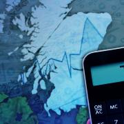 Graphic showing calculator and Scotland