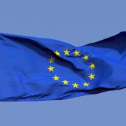 The blue and yellow flag of the EU