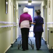 Generic image of old person with a nurse in a care home in Glasgow..