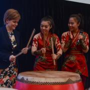 First Minister Nicola Sturgeon has a go on the drums with the Beijing Red Poppy Ladies Percussion Group at a Scotland reception to showcase the best of Scottish food, drink and culture in 2015.