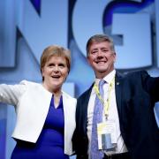 First Minister Nicola Sturgeon with the party's newly deputy leader Keith Brown on stage during the SNP spring conference in Aberdeen in 2018. Photo Jane Barlow/PA.