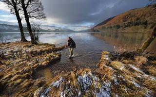 An angler stands in the River Tay on a wintry day at Kenmore, Perthshire. Picture: Jeff J Mitchell/Getty Images