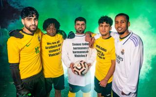 Players from the Scottish Unity Football League show their support for Brazil and Real Madrid winger Vinicius Jr