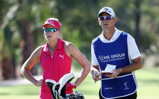 Lexi Thompson of the United States stands with caddie Kevin McAlpine