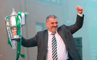 Ange Postecoglou holds the Scottish Cup aloft to Celtic fans at Parkhead last night