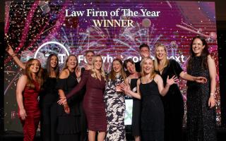 TLT LLP were winners of Law Firm of the Year at the 2022 Herald Law Awards.  Presenting the award is Connie Nimmo, Legal Recruitment Consultant, IDEX Consulting, left and host Jennifer Reoch, far right