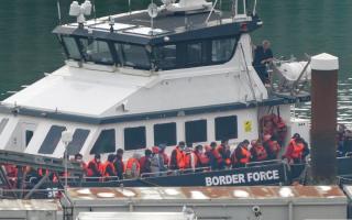 A Border Force vessel arrives in  Dover