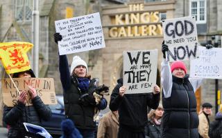 Demonstrators protesting against the Hate Crime Act outside the Scottish Parliament on Monday