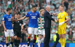 Celtic goalkeeper Joe Hart, right, shakes hands with Rangers manager Philippe Clement, second right, at Hampden today as Ibrox defender Leon Balogun, second left, holds his team mate Nicolas Raskin, left back