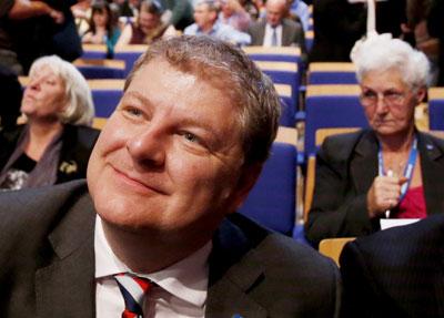 All smiles: Angus Robertson after the vote