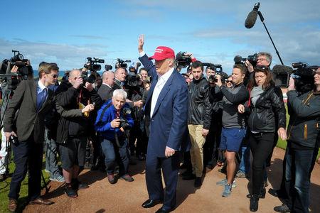 HeraldScotland: Donald Trump speaks to the media after arriving by helicopter at his Trump Turnberry golf course in Ayrshire, which is hosting the Ricoh Women's British Open.