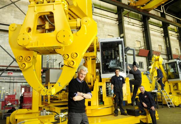 HeraldScotland: Employees at Clansman Dynamics with Dick Philbrick in foreground