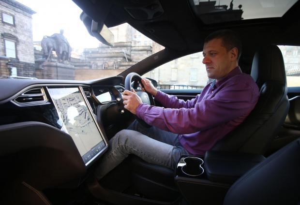 HeraldScotland: Herald motoring journalist Stephen Park test drives the new Model S in Edinburgh
