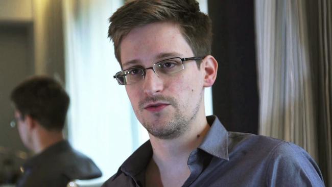 NSA whistleblower Edward Snowden, an analyst with a U.S. defence contractor, is seen in this file still image taken from video during an interview by The Guardian in his hotel room in Hong Kong June 6, 2013.  U.S. prosecutors have filed a sealed criminal 