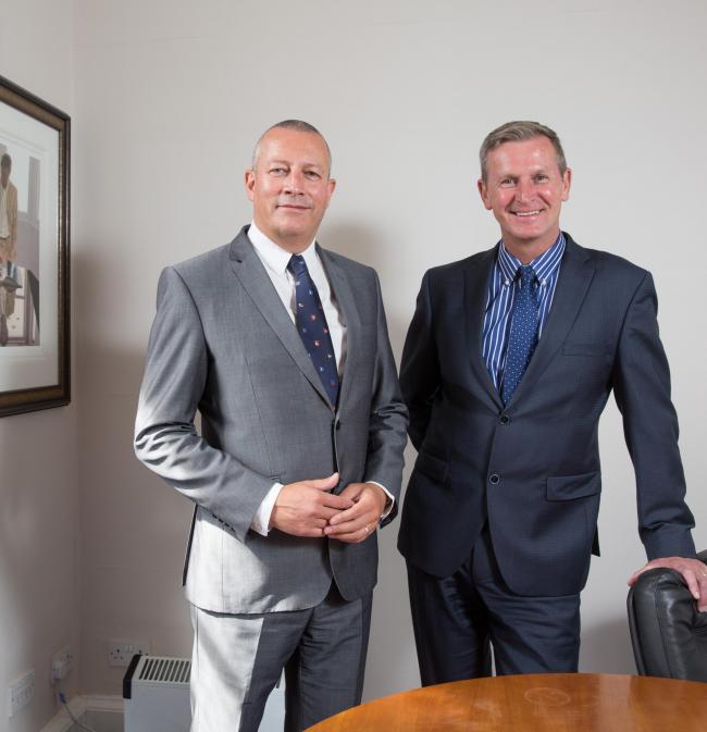 RUSSELL Davidson, left, and David Hastie will be reunited in a working capacity as a result of the merger between their firms.