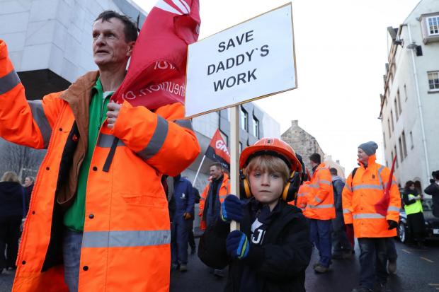HeraldScotland: Jay Anthony, six, from Burntisland joins workers from crisis-hit fabrication firm BiFab as they march through Edinburgh to the Scottish Parliament (Andrew Milligan/PA)