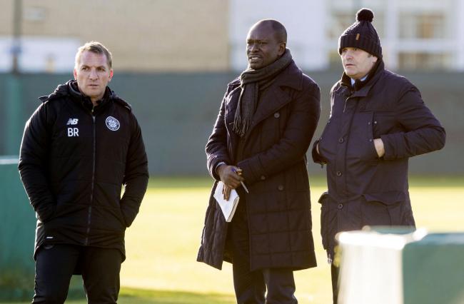 Celtic manager Brendan Rodgers, left, watches training with Allan Preston, right.
