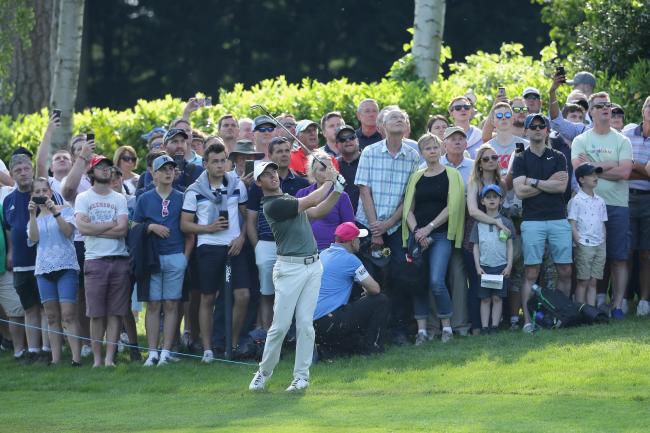Eventful day: Rory McIlroy hit two spectators with errant shots but still shares the lead at Wentworth (Picture: Getty)
