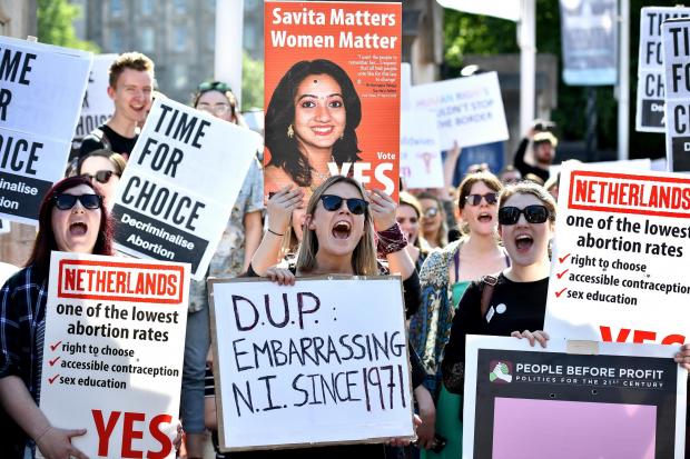 Women outside Belfast City Hall call for abortion rights.Women in Northern Ireland, where abortion is illegal, have to travel to England, Scotland or Wales to have an abortion. Photograph: Charles McQuillan/Getty Images.