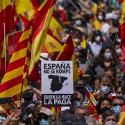Thousands gather during a protest against the Spanish government's plan to issue pardons to a dozen imprisoned Catalan separatist leaders, in Madrid in 2021.