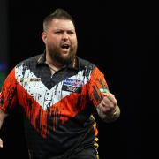Michael Smith booked his place in Premier League play-offs at the O2 Arena next week (Martin Rickett/PA)
